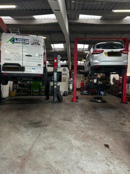Vehicles Raised for Repair on Automotive Lifts